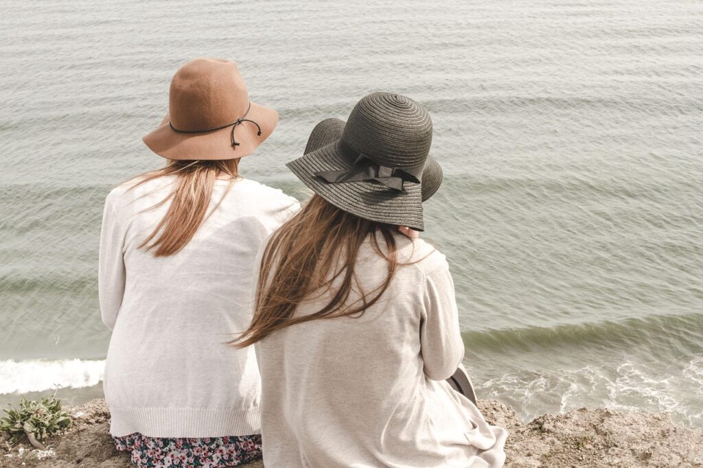 beach, hats, women, pair, couple, fashion, style, nature, stylish, backs, young women, shore, seashore, friendship, girl friends, ocean, outdoors, people, sand, sea, water, friends